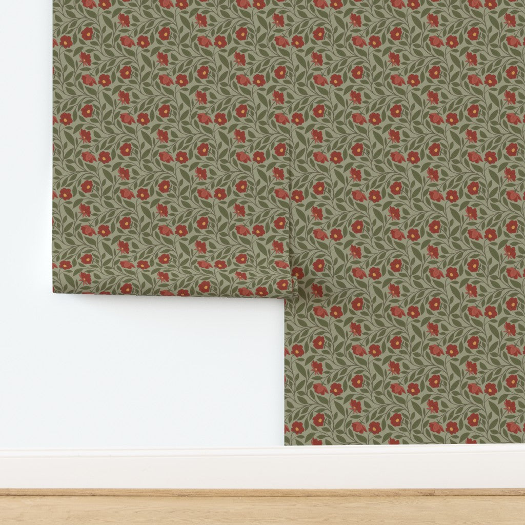 Roll of floral wallpaper with red flowers on a green background