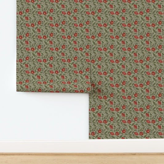 Roll of floral wallpaper with red flowers on a green background