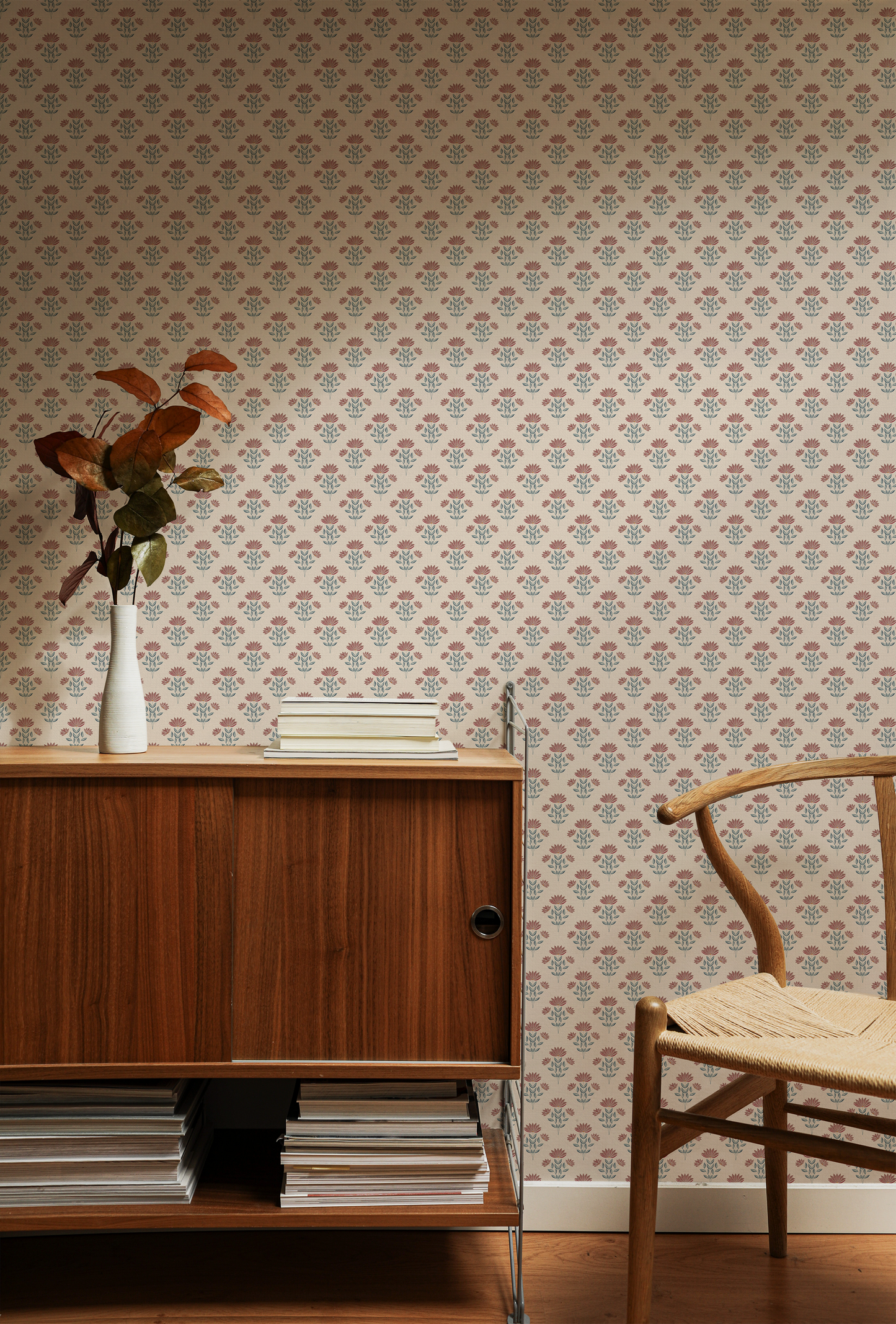 Room interior with wooden sideboard, chair, and patterned wallpaper